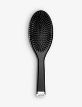 Oval dressing brush