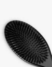 Oval dressing brush