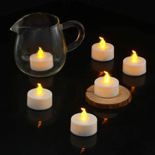 12 Pack Realistic and Bright Flickering Battery Operated Flameless LED Tea Lights Candles, tealights Electric Fake Candles for Halloween Christmas Weddings Festivals Decoration in Warm Yellow