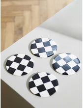 Checked circular plastic coasters set of four