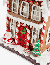 Light-up gingerbread house Christmas ornament