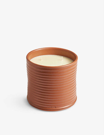 Anagram-embossed ceramic candle lid